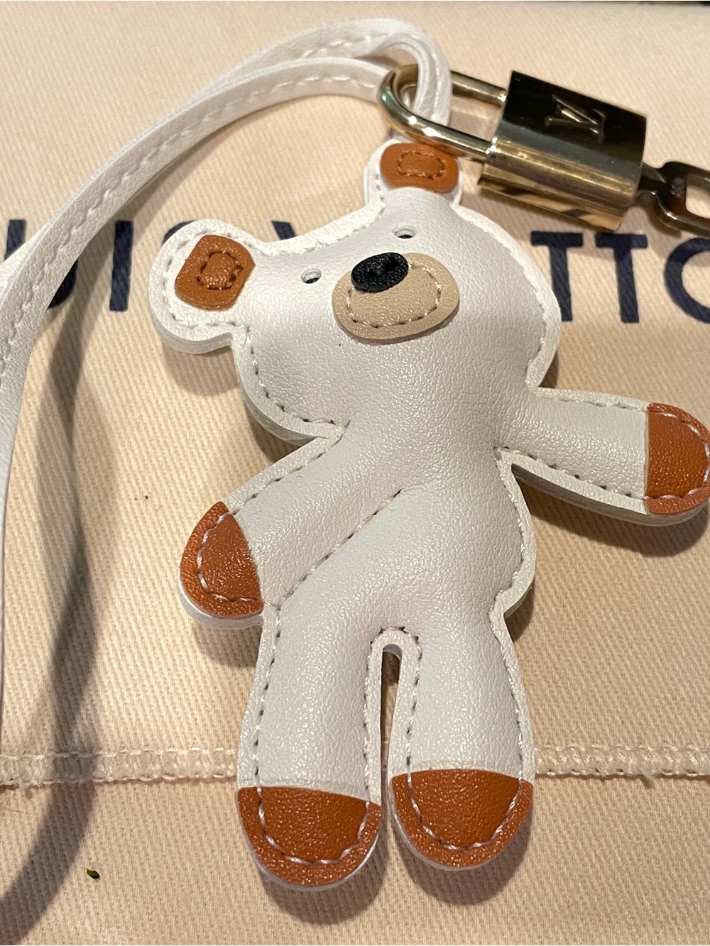 Louis Vuitton lock and key # 433 with Teddy Bear Bag charm